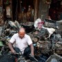 Chor Bazar, car area, Mumbai (please note the clean shirt of the worker!), India